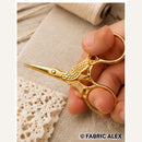 Gold stork embroidery scissors in use - Fabric Alex