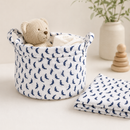 Navy dolphin polycotton fabric shown as a nursery storage basket