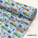 Colourful trains on light blue polycotton fabric © Fabric Alex