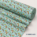 Unicorns and rainbows on mint polycotton fabric © Fabric Alex