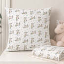 Unicorn and teal star polycotton fabric shown as a cushion