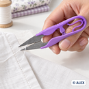 Purple thread snips trimming a loose thread