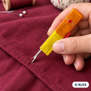 Retractable safety seam ripper removing a stitch