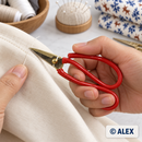 Red Loop-Handle Thread Snips in use