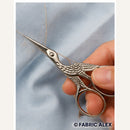 Silver stork embroidery scissors in use - Fabric Alex