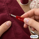 Standard seam ripper removing a stitch