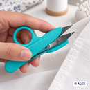 Turquoise thread snips trimming a loose thread